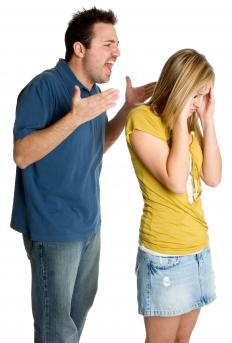 A man bullying a woman.