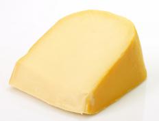 Wedge of smoked gouda cheese