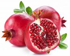 Whole and cut pomegranate