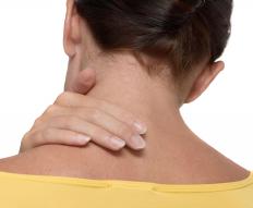 A woman experiencing muscle stiffness in the neck.