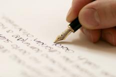 A person writing a thank you note