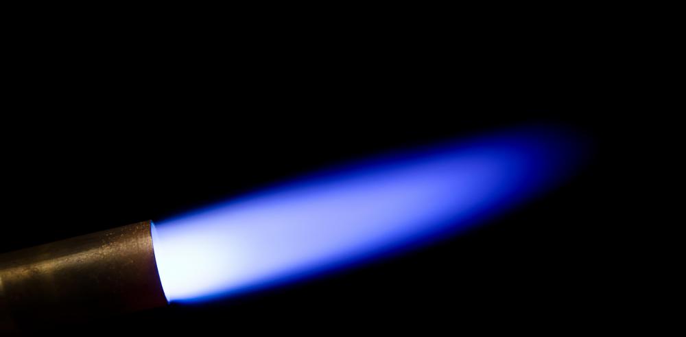 A blowtorch's flame is hot enough to precisely cut metal or fuse metal pieces together.