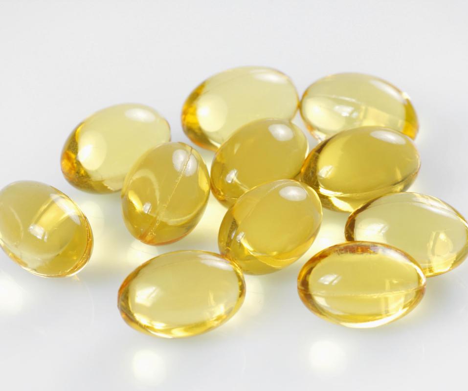 What are some symptoms of excess vitamin D?