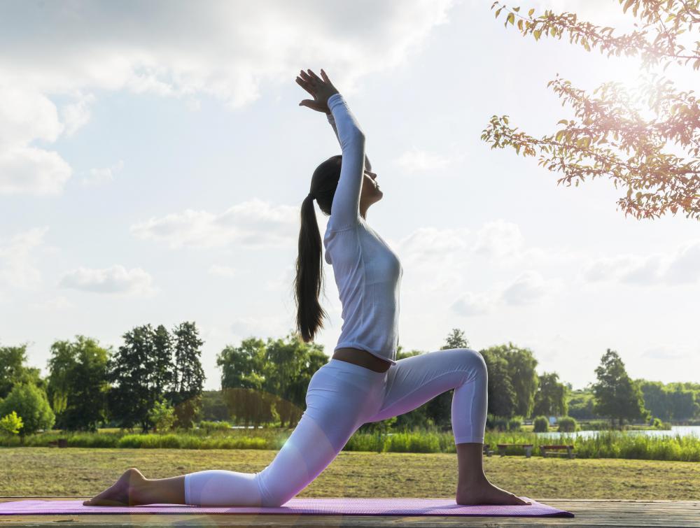 female-doing-yoga-outdoors-near-tree.jpg