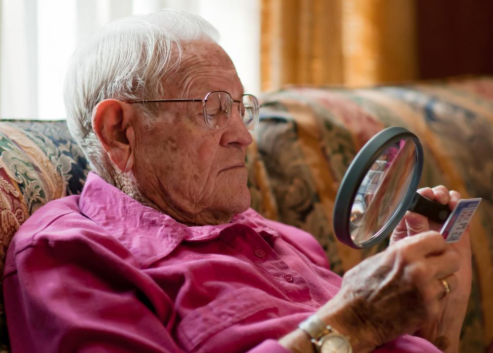 old-man-in-pink-holding-magnifying-glass.jpg