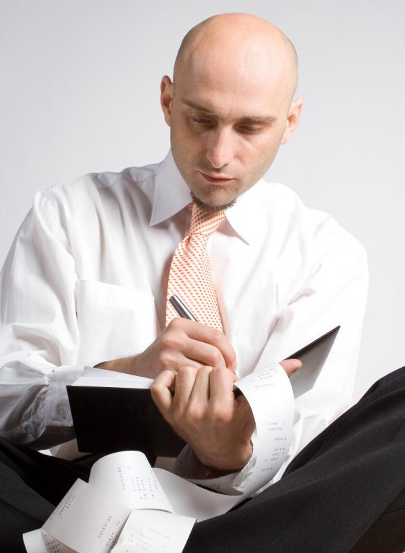 Seated Man In Suit With Book And Receits 