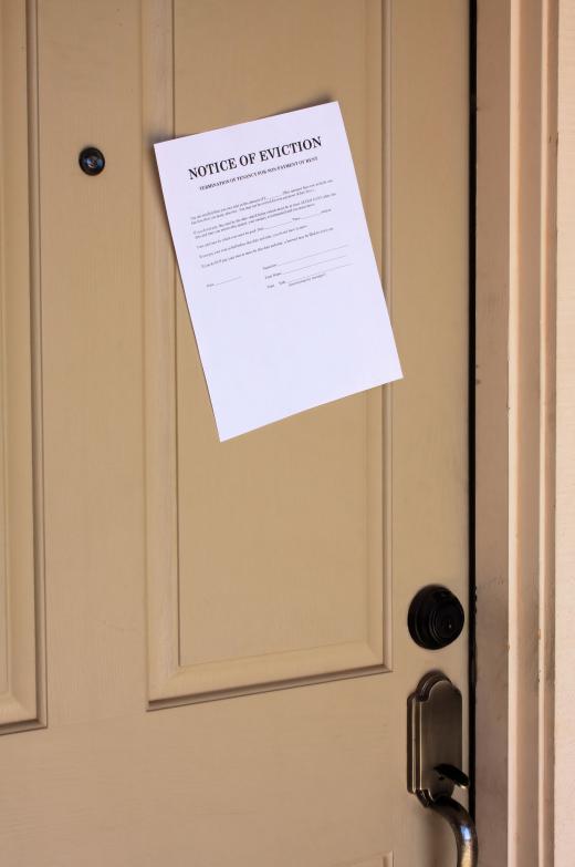 A notice of eviction posted on a door.