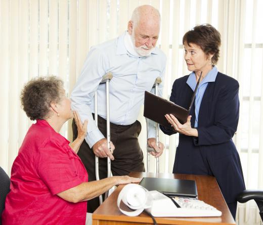 People consulting with a personal injury solicitor after a car accident.