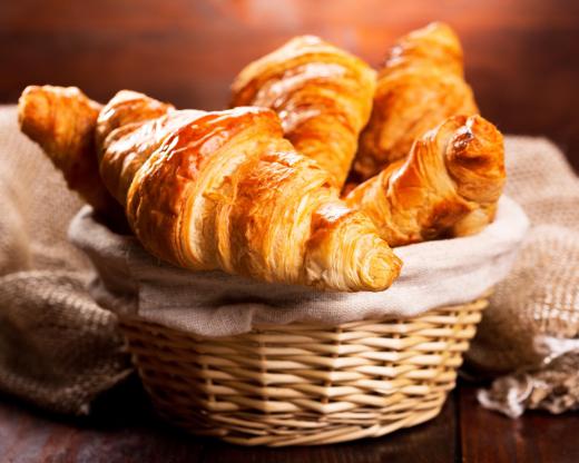 Croissants are made of flaky pastry dough.