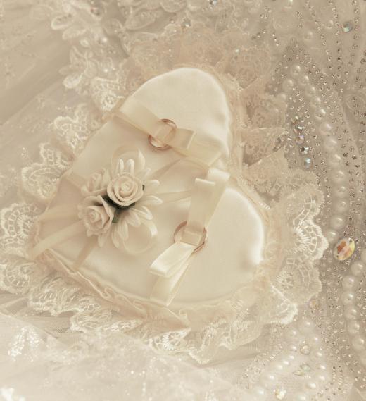 The bride's dress and wedding theme should be considered when selecting the mother's wedding attire.