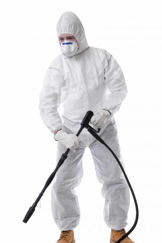 Crime scene cleanup technicians wear protective suits.