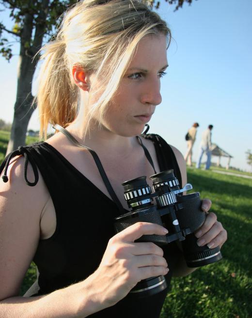 Binoculars can be used to observe individuals at a distance.