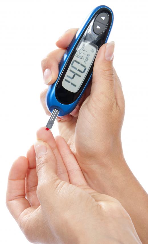 A person with diabetes checking her blood glucose levels.