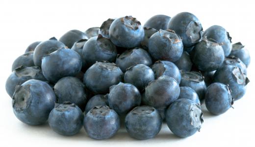 Blueberries provide a healthy and sweet addition to muffins.