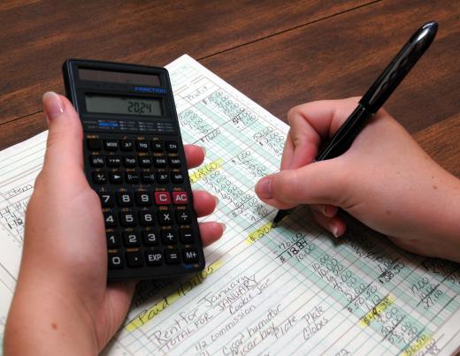 A bookkeeper reviewing a ledger.