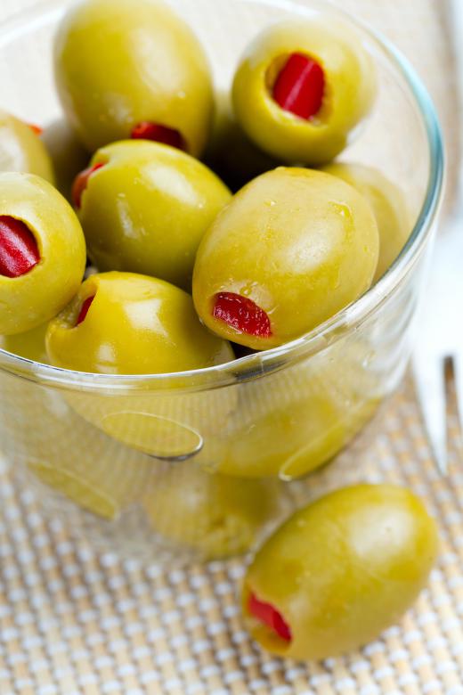 A muffuletta sandwich features green olives.