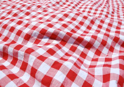 A new tablecloth can help update a porch patio table.