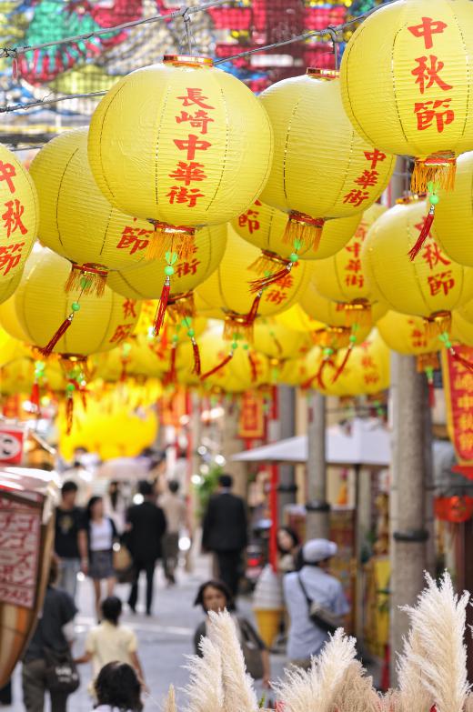 A street decorated with paper lanterns.