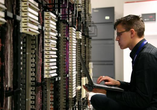 A computer security analyst evaluates computers to determine if they are vulnerable to cyber threats.