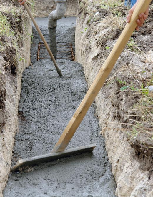 Laid paving involves pouring concrete directly into the project area that has been outlined by molded barriers.