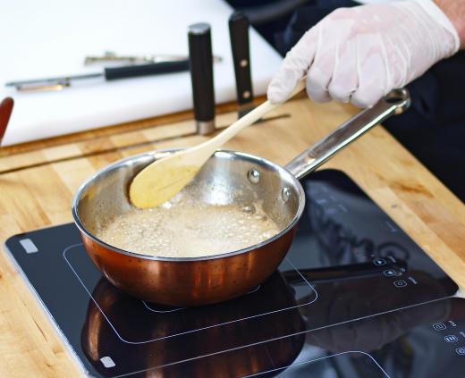 Cooking on an induction cooker that has two burners.