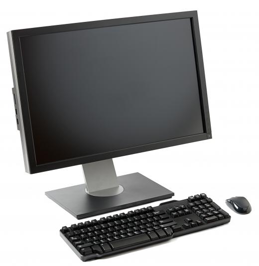 A computer and accessories on a desk.