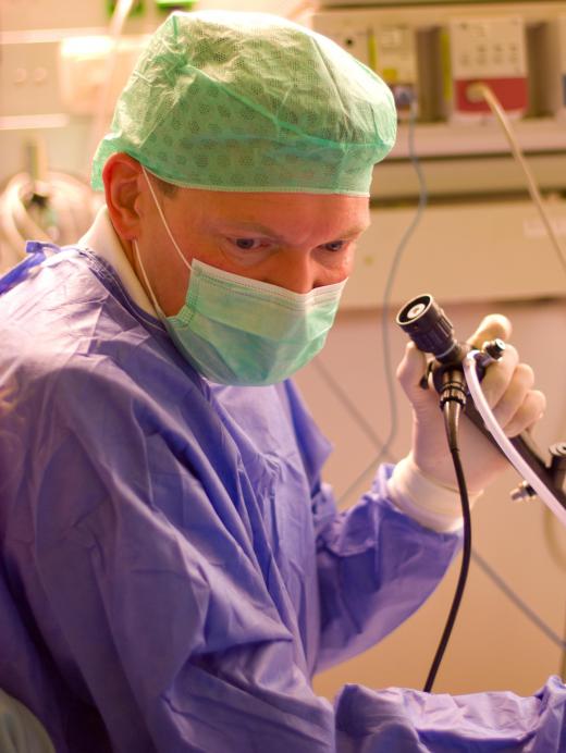 Ths surgeon uses the endoscope to guide the surgery.