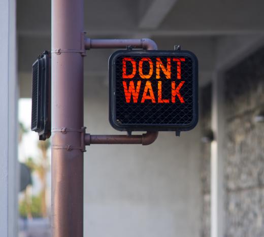 Pedestrian signals may use the English words "Don't Walk" or "Walk" instead of pictographs.