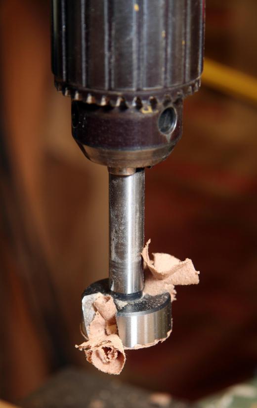 A drill with a Forstner bit.