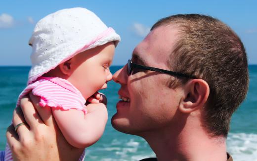 An infant and her father.