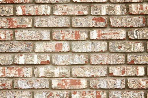 A faux brick backsplash uses tiles shaped and textured like bricks.