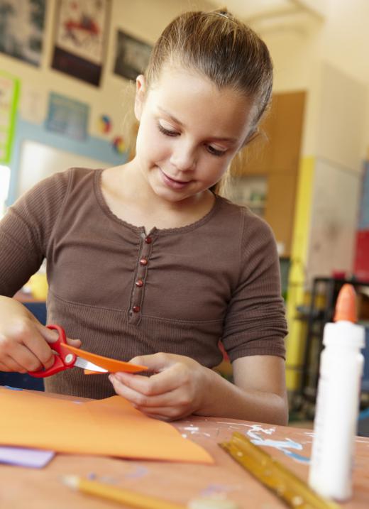 Pasting letters onto construction paper to make words may help kids learn their spelling.