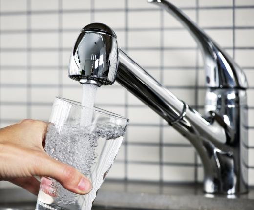 A single tap kitchen faucet.