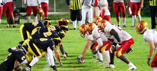 Football players, particularly linemen, often wear forearm pads.