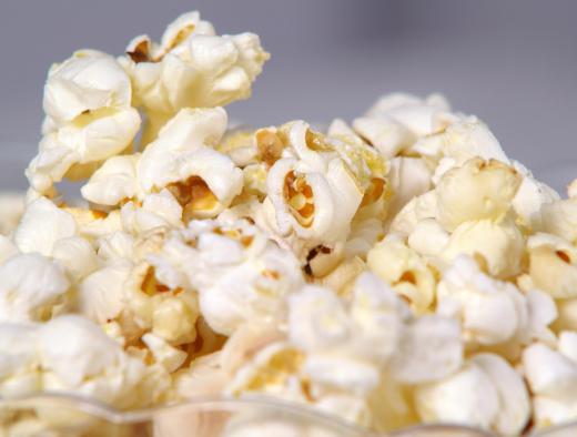 Air popped popcorn with no added butter or salt can be considered healthy junk food that adds a small amount of protein, trace minerals, and fiber to one's diet.