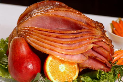 Ham is cut up into small bits for ham lentil soup.