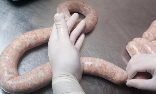 Some meatcutters prepare specialty sausages.