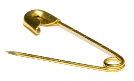 A safety pin may be used to secure a corsage.