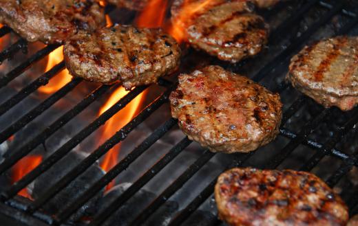 Grilling involves cooking meat over an open pit.