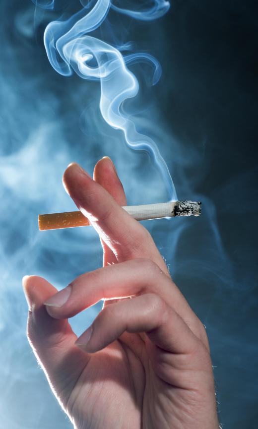 Secondhand smoke rising from a cigarette, which can cause problems with oxygen saturation.