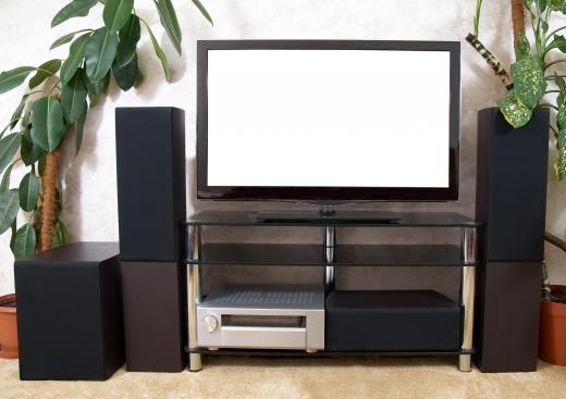 A home theater with a television, receiver, and speakers.