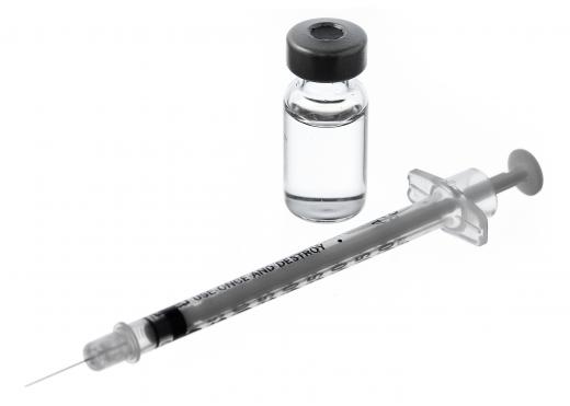 A small syringe and vaccine vial.