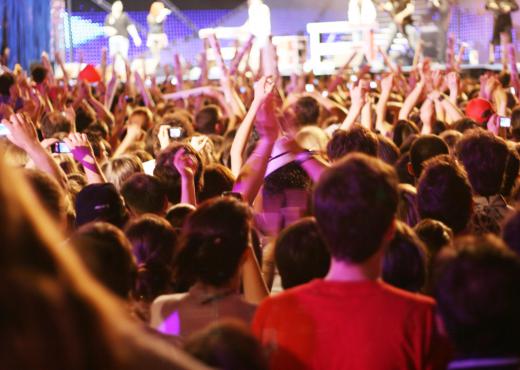 Ticket takers are typically posted at the entrance to a concert.