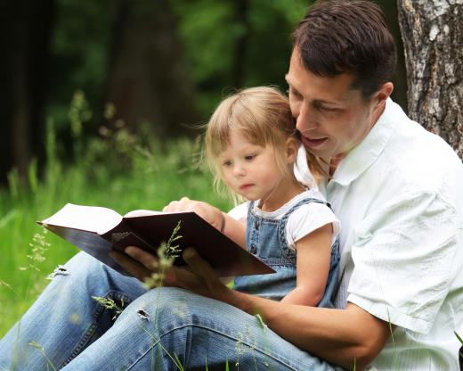 Having a child practice their reading with a parent can help develop literacy.