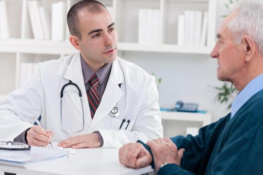 A physician will discuss the options for testicular cancer treatment with a patient.