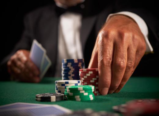 Signs of compulsive gambling can include risking large sums of money at casinos.