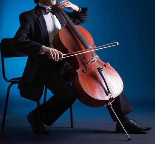 Set the cello upright as if you are going to play it, and begin tuning one string at a time.