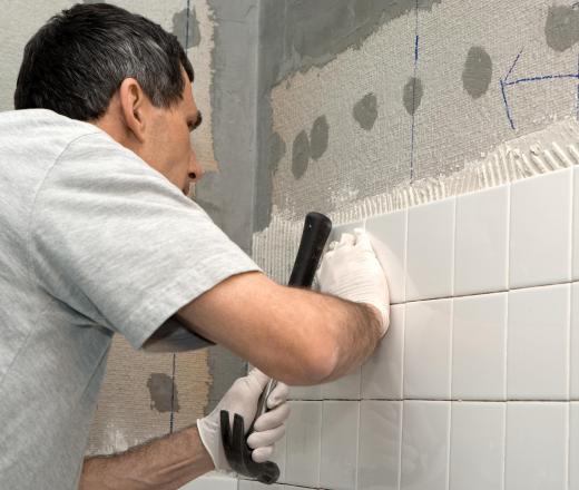 When installing tiles, grout should sit for 72 hours or longer after being applied for it to completely dry.