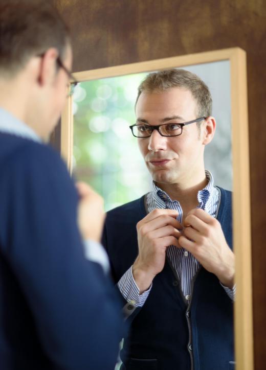 A narcissistic person may spend a lot of time admiring themselves in a mirror.