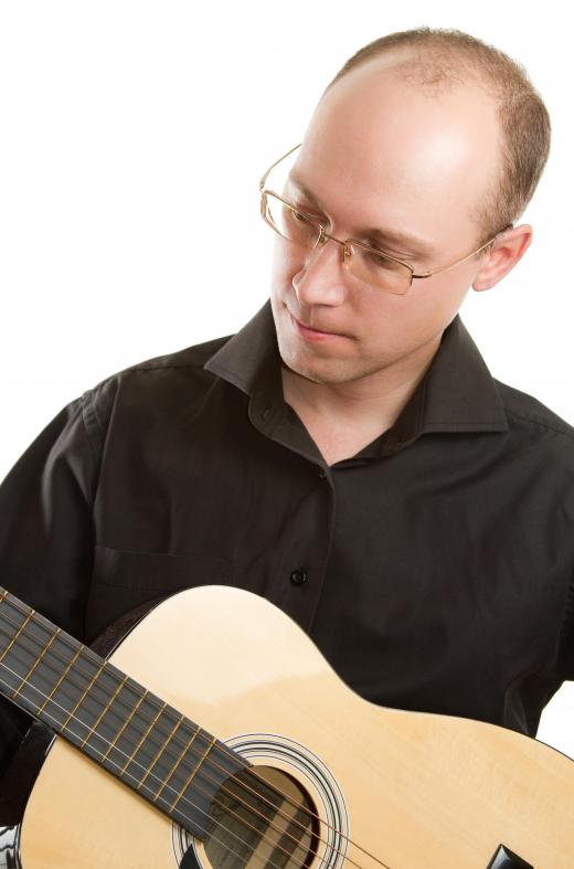 A lyricist might benefit from learning an instrument, like a guitar.